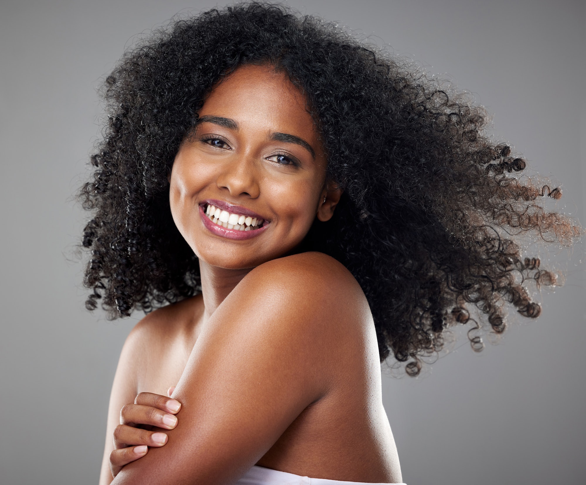 Beauty, skincare and hair care of black woman with smile for cosmetics, makeup and dermatology mock